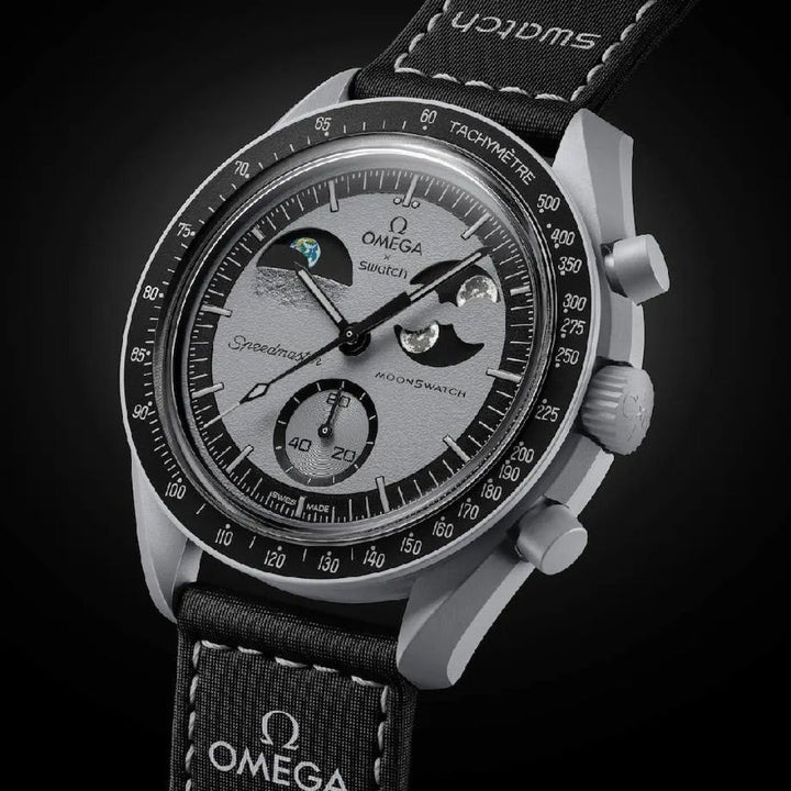 Omega watch with detailed face and black strap on a dark background